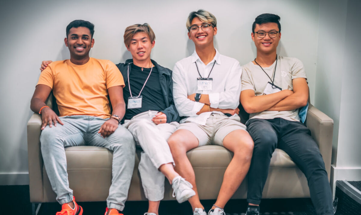 Four Connect leaders sitting together on a couch, laughing
